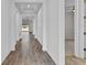 Long hallway with tile flooring leading to living areas at 3875 Bowfin Trl, Kissimmee, FL 34746