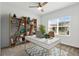 Home office with built-in shelving and a large window at 3875 Bowfin Trl, Kissimmee, FL 34746