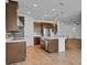 Modern kitchen with stainless steel appliances and an island at 3875 Bowfin Trl, Kissimmee, FL 34746