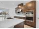 Modern kitchen with stainless steel appliances and an island at 3875 Bowfin Trl, Kissimmee, FL 34746
