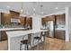 Modern kitchen featuring stainless steel appliances and an island with seating at 3875 Bowfin Trl, Kissimmee, FL 34746