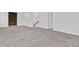 Spacious loft area with wood accent wall and plush carpeting at 3875 Bowfin Trl, Kissimmee, FL 34746