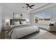 Comfortable main bedroom with a ceiling fan and plenty of natural light at 3875 Bowfin Trl, Kissimmee, FL 34746