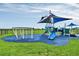 Modern playground with shade structures at 3875 Bowfin Trl, Kissimmee, FL 34746
