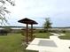 Scenic community view with a walking path, observation tower, and lake in the background at 4520 Gliding Wave St, Winter Garden, FL 34787