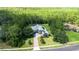 Beautifully landscaped home with a brick driveway and mature trees in a quiet neighborhood at 14121 Bella Ln, Orlando, FL 32832