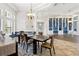Dining room adjacent to the living room with custom bookshelves at 14121 Bella Ln, Orlando, FL 32832