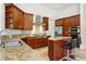 Beautiful kitchen showcasing granite countertops, ample cabinetry, and modern stainless steel appliances at 14121 Bella Ln, Orlando, FL 32832