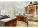 Open kitchen design with a central island, granite countertops, and a bright breakfast nook at 14121 Bella Ln, Orlando, FL 32832