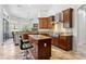 Spacious kitchen with dark wood cabinets, granite countertops, and stainless steel appliances at 14121 Bella Ln, Orlando, FL 32832