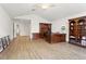 Spacious office has hardwood floors, dark wood desk and bookcase, and vaulted ceilings at 14121 Bella Ln, Orlando, FL 32832