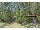 Fun backyard treehouse with swing among mature landscaping and shade at 14121 Bella Ln, Orlando, FL 32832