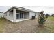 Private backyard with covered patio at 1634 Sugarbelle Cir, Mascotte, FL 34753