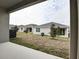 Private backyard with covered patio and AC unit at 1634 Sugarbelle Cir, Mascotte, FL 34753