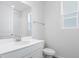 Clean bathroom with white vanity, a toilet, and shower at 1634 Sugarbelle Cir, Mascotte, FL 34753