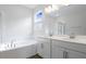 Bathroom boasts double vanity, garden tub, and shower at 1634 Sugarbelle Cir, Mascotte, FL 34753