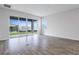 Living area featuring sliding glass doors opening to the backyard at 1634 Sugarbelle Cir, Mascotte, FL 34753