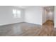 Bright and airy living room with wood-look tile flooring at 1634 Sugarbelle Cir, Mascotte, FL 34753