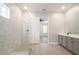 This stylish bathroom offers a spacious walk-in shower and double vanity sink with modern fixtures at 1862 Beach Ridge Rd, Celebration, FL 34747