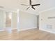 Neutral room with hardwood floors, ceiling fan, and connecting bathroom at 1862 Beach Ridge Rd, Celebration, FL 34747