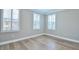 This bright bedroom has hardwood floors, many shutters, and natural light at 1862 Beach Ridge Rd, Celebration, FL 34747