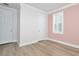 Bedroom features bright white trim, closet with bi-fold doors, and shuttered windows at 1862 Beach Ridge Rd, Celebration, FL 34747