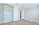 Bright bedroom features a custom closet system and light, wood-look flooring at 1862 Beach Ridge Rd, Celebration, FL 34747