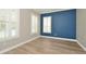 Bright bedroom with neutral walls, white trim, and an accent wall that provides a calm and inviting space at 1862 Beach Ridge Rd, Celebration, FL 34747