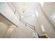 Two-story foyer with chandelier, natural light, and staircase with painted gray trim at 1862 Beach Ridge Rd, Celebration, FL 34747