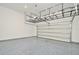 The spacious garage has epoxy floors and overhead storage racks at 1862 Beach Ridge Rd, Celebration, FL 34747