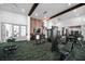 Community gym offers many machines for exercise and a green, leafy patterned floor at 1862 Beach Ridge Rd, Celebration, FL 34747