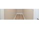 Hallway featuring light-colored wood floors and neutral colored walls at 1862 Beach Ridge Rd, Celebration, FL 34747