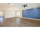Living room with elegant crown molding, a ceiling fan, plantation shutters, and hardwood flooring at 1862 Beach Ridge Rd, Celebration, FL 34747