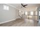Bright living area with an ornate chandelier, hardwood flooring, and several window views at 1862 Beach Ridge Rd, Celebration, FL 34747