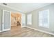Inviting living room with glass French doors and views of the staircase and abundant natural light at 1862 Beach Ridge Rd, Celebration, FL 34747
