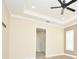 Spacious main bedroom featuring tray ceilings and an ensuite bathroom entrance, creating a luxurious retreat at 1862 Beach Ridge Rd, Celebration, FL 34747