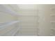 This pantry has several metal shelves for storing food or other items in an organized fashion at 1862 Beach Ridge Rd, Celebration, FL 34747