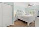 Bright bedroom with a queen-size bed and double door closet at 4552 Jonafree Ln # 106, Kissimmee, FL 34746