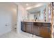 Modern bathroom with double vanity and large mirror at 4222 Paragraph Dr, Kissimmee, FL 34746