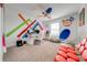 Stylish bedroom with a modern desk setup and colorful decor at 4222 Paragraph Dr, Kissimmee, FL 34746