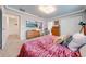 Spacious bedroom with large bed, dresser, and walk-in closet at 4222 Paragraph Dr, Kissimmee, FL 34746