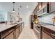 Modern kitchen with stainless steel appliances and an eat-in kitchen island at 4222 Paragraph Dr, Kissimmee, FL 34746