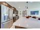 Modern kitchen with stainless steel appliances and white quartz countertops at 4222 Paragraph Dr, Kissimmee, FL 34746