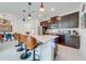 Modern kitchen with dark cabinetry, stainless steel appliances, and a large island at 4222 Paragraph Dr, Kissimmee, FL 34746