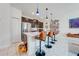Modern kitchen with stainless steel appliances and breakfast bar at 4222 Paragraph Dr, Kissimmee, FL 34746