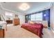 Spacious main bedroom with a large bed and geometric patterned wall at 4222 Paragraph Dr, Kissimmee, FL 34746