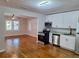 Modern kitchen with stainless steel appliances and white cabinets at 819 State Ave, Daytona Beach, FL 32117