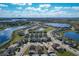 Panoramic aerial view of a lakeside residential community, highlighting the community's setting and numerous homes at 185 Brookes Pl, Haines City, FL 33844