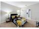 Bedroom with carpet, a window, mirrored nightstands, and a floral comforter at 185 Brookes Pl, Haines City, FL 33844