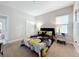 Bedroom with carpet, a window, mirrored nightstands, and a floral comforter at 185 Brookes Pl, Haines City, FL 33844